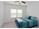 Bedroom with teal patterned bedding and ample natural light at 7531 Sw 77Th Ave, Ocala, FL 34481