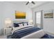 Bright bedroom with navy blue bedding and window coverings at 7531 Sw 77Th Ave, Ocala, FL 34481