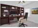 Home office with built-in shelving and comfortable chair at 7531 Sw 77Th Ave, Ocala, FL 34481