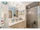 Clean bathroom featuring a vanity with a large mirror, and a glass enclosed shower at 10978 Sw 83Rd Ave, Ocala, FL 34481