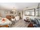 Comfortable living room with ample seating, stylish rug, and warm decor at 10978 Sw 83Rd Ave, Ocala, FL 34481