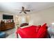 Cozy main bedroom with en-suite bathroom access and a comfortable seating area at 10978 Sw 83Rd Ave, Ocala, FL 34481