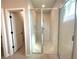 Bathroom with tile-surround shower, and glass door at 13374 Sw 63Rd Ter, Ocala, FL 34473