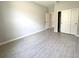 Neutral bedroom with hard floors, sliding closet doors, and natural light at 13374 Sw 63Rd Ter, Ocala, FL 34473
