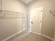 Walk-in closet with built in shelving, light gray walls, and wood look flooring at 13374 Sw 63Rd Ter, Ocala, FL 34473