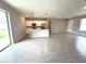 Spacious living area with tile floors, a kitchen island, and stainless steel appliances at 13374 Sw 63Rd Ter, Ocala, FL 34473