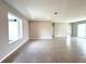 Bright and airy living space features tile flooring, neutral paint, and ample natural light at 13374 Sw 63Rd Ter, Ocala, FL 34473