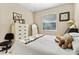 Bedroom featuring natural light, neutral tones, and a ceiling fan at 8257 Sw 196Th Court Rd, Dunnellon, FL 34432