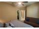 Bedroom featuring a ceiling fan, a view of a bathroom, and a closet at 8257 Sw 196Th Court Rd, Dunnellon, FL 34432