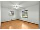 Bright bedroom with hardwood floors and natural light from two windows at 5721 Se 22Nd Pl, Ocala, FL 34480