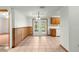 Dining area with tile flooring, wood trim, and French doors opening to an outdoor area at 5721 Se 22Nd Pl, Ocala, FL 34480