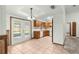 Dining room with tile floor and cabinets. French doors lead to back porch at 5721 Se 22Nd Pl, Ocala, FL 34480