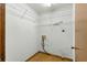 Functional laundry room with built-in wire shelving and washer-dryer hookups at 5721 Se 22Nd Pl, Ocala, FL 34480