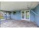 Covered outdoor patio with ample space for entertaining and relaxation at 5721 Se 22Nd Pl, Ocala, FL 34480