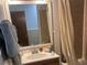 Bathroom features a vanity with mirror and shower at 6340 Se 127Th Pl, Belleview, FL 34420