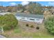 House with green roof and white siding, aerial view at 6521 Sw 108Th St, Ocala, FL 34476