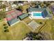 Aerial view of community features including tennis courts, pool, and shuffleboard at 2398 Nw 50Th Ave, Ocala, FL 34482