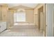 Bathroom with soaking tub, shower, and updated flooring at 2398 Nw 50Th Ave, Ocala, FL 34482