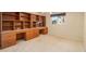 Spacious home office with built-in shelving and window at 2398 Nw 50Th Ave, Ocala, FL 34482