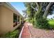 Brick patio walkway leads to a spacious backyard at 2398 Nw 50Th Ave, Ocala, FL 34482