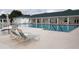 Community pool with lounge chairs and patio area at 2398 Nw 50Th Ave, Ocala, FL 34482