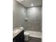 Bathroom with a walk-in shower and granite vanity at 4030 Se 134Th St, Belleview, FL 34420