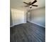 Bedroom with double door closet and vinyl flooring at 4030 Se 134Th St, Belleview, FL 34420