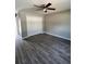 Spacious bedroom with vinyl plank floors and a large closet at 4030 Se 134Th St, Belleview, FL 34420