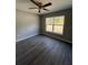 Bright bedroom with vinyl plank flooring and ceiling fan at 4030 Se 134Th St, Belleview, FL 34420