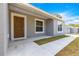 A close-up of the front door, showcasing the house's entrance and facade at 4030 Se 134Th St, Belleview, FL 34420