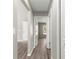 Long hallway featuring multiple rooms at 4030 Se 134Th St, Belleview, FL 34420