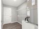 A laundry room with shelving and modern flooring at 4030 Se 134Th St, Belleview, FL 34420