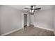 Well-lit bedroom with ceiling fan, hardwood floors and double door closet at 5761 Ne 4Th Pl, Ocala, FL 34470