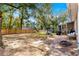 Backyard with patio, wooden fence, and trees at 6990 Se 122Nd Ln, Belleview, FL 34420