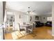 Bright dining room featuring hardwood floors and a modern dining table at 6990 Se 122Nd Ln, Belleview, FL 34420