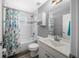Cozy bathroom featuring a tub with shower, vanity with stylish marble countertop, and a decorative shower curtain at 1934 Nw 79Th Loop, Ocala, FL 34475