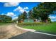 The Irish Acres community entrance features manicured landscaping and a brick sign under a blue sky at 1934 Nw 79Th Loop, Ocala, FL 34475