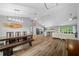 Open concept floorplan featuring dining area, kitchen with granite countertops, and bright living room at 1934 Nw 79Th Loop, Ocala, FL 34475