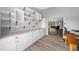 Well-organized pantry with custom shelving, ample counter space, and sleek cabinetry, showcasing modern storage solutions at 1934 Nw 79Th Loop, Ocala, FL 34475