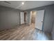 Bedroom featuring wood-look flooring, closet, and neutral paint at 3174 Sw 189Th Ave, Dunnellon, FL 34432
