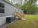 Home exterior with stairs leading to the backyard at 3174 Sw 189Th Ave, Dunnellon, FL 34432