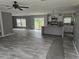 Open concept living and kitchen area with wood floors at 3174 Sw 189Th Ave, Dunnellon, FL 34432