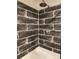 Close-up of tiled shower with a modern shower head and updated faucet at 3174 Sw 189Th Ave, Dunnellon, FL 34432