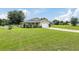 House exterior showing front yard, driveway, and garage at 4660 Sw 130Th St, Ocala, FL 34473