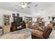 Living room with reclining sofas and large TV at 4660 Sw 130Th St, Ocala, FL 34473