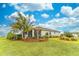 Landscaped backyard with lush tropical plants and grassy area at 9124 Sw 84Th Ln, Ocala, FL 34481