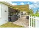 Patio with retractable awning, grill, and brick pavers at 9124 Sw 84Th Ln, Ocala, FL 34481