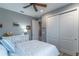 Bedroom with a queen bed, dresser, and closet at 9124 Sw 84Th Ln, Ocala, FL 34481