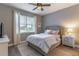 Bedroom with a queen bed, nightstand, and ceiling fan at 9124 Sw 84Th Ln, Ocala, FL 34481