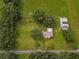 Aerial view of a house and barn on a large lot at 1000 Se 155Th St, Summerfield, FL 34491